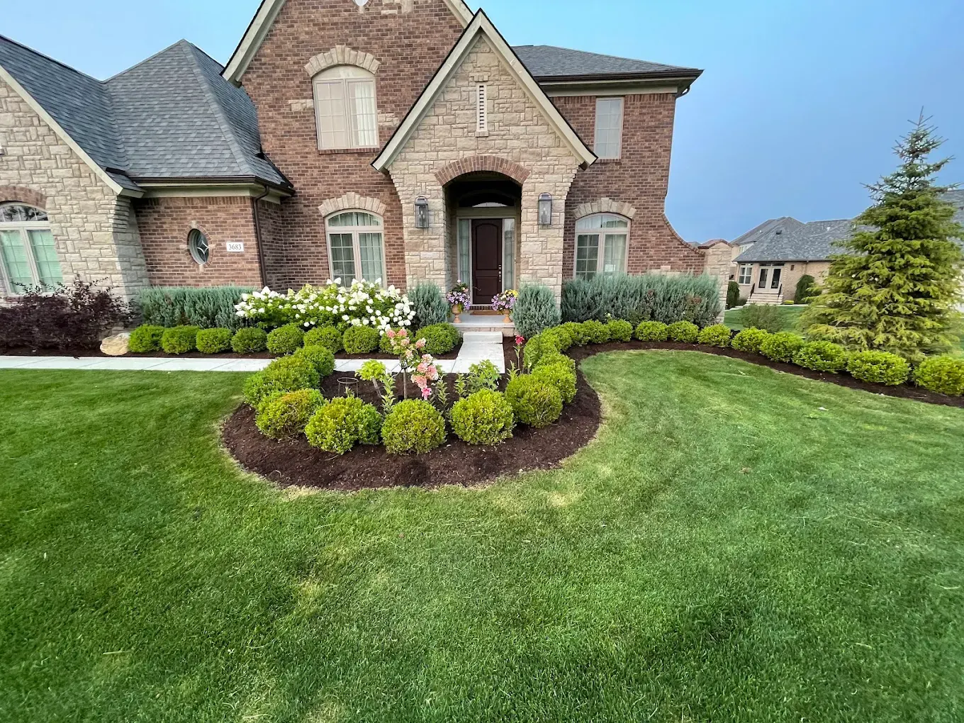 Mulch installation in Rochester Hills MI foundation bed